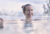 Mastering the Elements: Your Comprehensive Guide to Pool Heating Solutions | Woman in warm pool | Immerspa