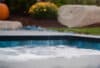 Inground Hot Tub | Inground Spa with natural rock wall and gardens surrounding | Immerspa - The Best Fiberglass Inground Spas, Hot Tubs, & Pools